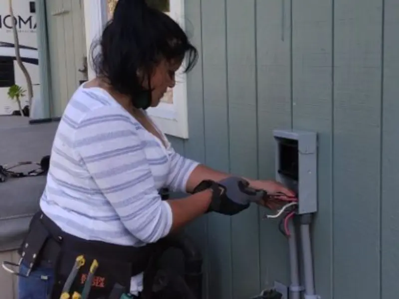 Licensed electrician wiring an exterior subpanel in Belgrade
